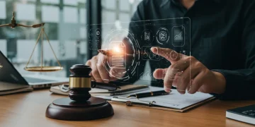Futuristic lawyer using AI-powered legal research interface in a modern office